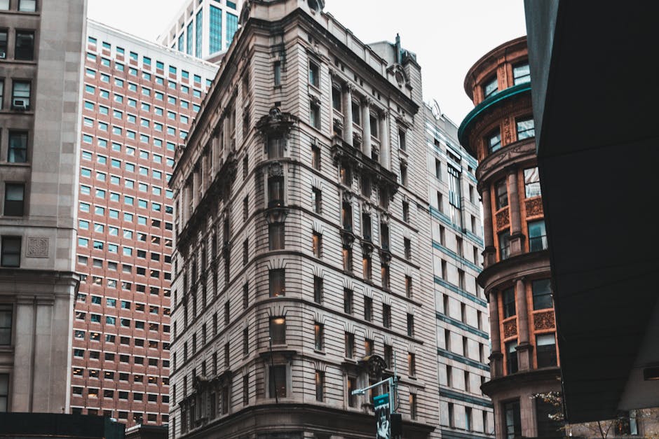 Dynamic view of architectural buildings in downtown Manhattan showcasing urban design.